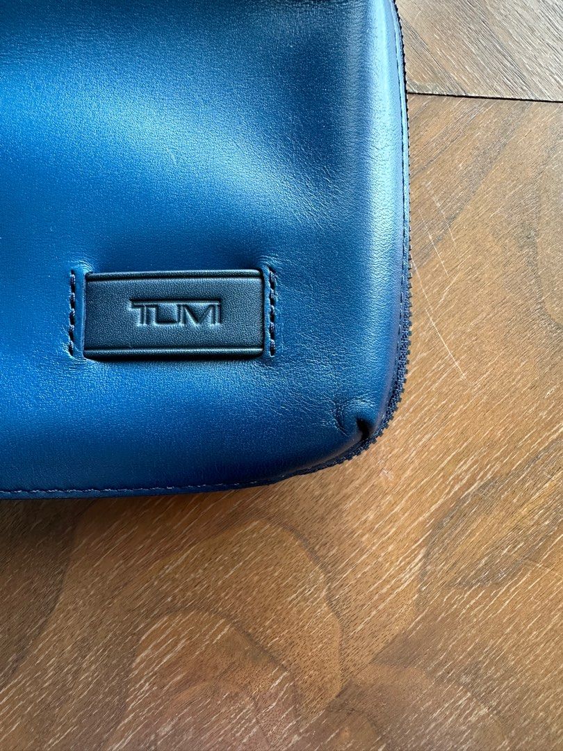 Tumi nassau sales triple zip clutch