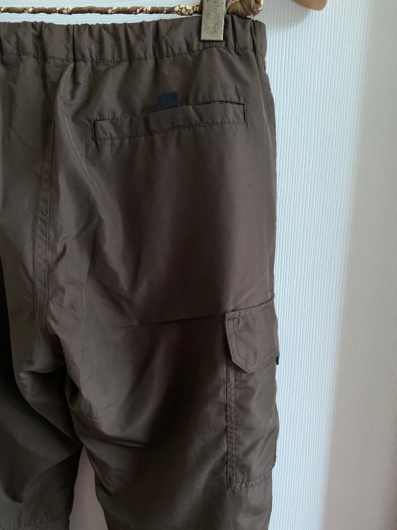 Uniqlo parachute cargo pants (Category: Other Bottoms) located in Guagua. Submitted by caifits (Listing ID 1261597965, Image 3). Description: Uniqlo parachute cargo pants - S on tag (68-76cm) // 24-34 (measured laid flat) -fits 24 (when cinched) to 34 (max. stretch) - see 2nd-4th photos to see the actual color - warm lined (super comfy, buttery feels) - built-in belt - can be worn as low waist, mid-waist or high-waist - very flattering -unisex 80