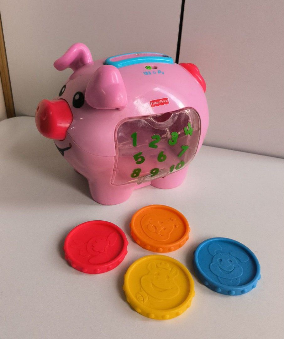 Fisher price laugh and learn piggy bank music and counting mode comes with 4 coins well function