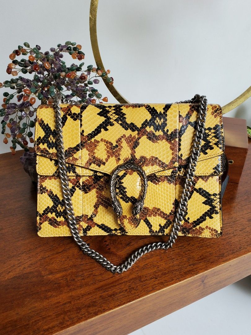Gucci Python Dionysus Medium Bag (Category: Luxury Bags & Wallets) located in Makati City. Submitted by tencel (Listing ID 1261838582, Image 1). Description: Gucci Python Dionysus Bag (Medium Size) - Very good condition. Hardly used. Some light lifting on scales. - Comes WITH dustbag, CITES certificate for exotic items, and Gucci card - It's a bit short for a crossbody unless you're petite? Im 5'9" and it's too short to be a crossbody for me 😅 -