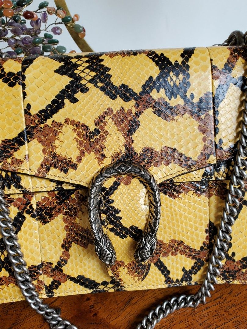 Gucci Python Dionysus Medium Bag (Category: Luxury Bags & Wallets) located in Makati City. Submitted by tencel (Listing ID 1261838582, Image 2). Description: Gucci Python Dionysus Bag (Medium Size) - Very good condition. Hardly used. Some light lifting on scales. - Comes WITH dustbag, CITES certificate for exotic items, and Gucci card - It's a bit short for a crossbody unless you're petite? Im 5'9" and it's too short to be a crossbody for me 😅 -