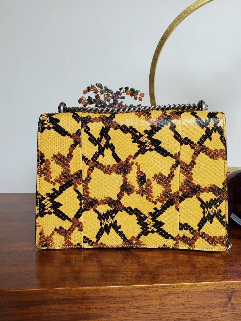 Gucci Python Dionysus Medium Bag (Category: Luxury Bags & Wallets) located in Makati City. Submitted by tencel (Listing ID 1261838582, Image 3). Description: Gucci Python Dionysus Bag (Medium Size) - Very good condition. Hardly used. Some light lifting on scales. - Comes WITH dustbag, CITES certificate for exotic items, and Gucci card - It's a bit short for a crossbody unless you're petite? Im 5'9" and it's too short to be a crossbody for me 😅 -