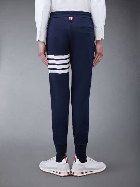 Thom Browne Loopback Knit Engineered 4-Bar Sweatpants Navy (Category: Joggers) located in Santa Cruz. Submitted by hongkongmarketph (Listing ID 1261876401, Image 2). Description: Thom Browne Loopback Knit Engineered 4-Bar Sweatpants Navy excellent condition 9/10 color rate Authentic Size 1 on tag Waist 30-36 Length 41 .