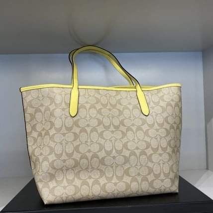 Light yellow sales coach purse