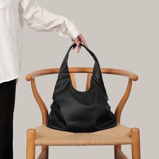 Tiny black shoulder bag