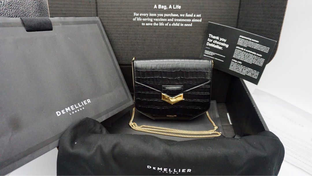 DeMellier Mini London black croc-effect (Category: Luxury Bags & Wallets) located in Manila. Submitted by samwear (Listing ID 1237339859, Image 2). Description: -Slightly used with hardware wrap -Bought personally in UK (I can provide screenshot of receipt) -dust bag, paper bag, gift message included -Elegant bag perfect for special occasions Top Width: 17cm/6.7” Opening Width: 18cm/7” Base Width: 8cm/3.3” Height: 14.5cm/5.7” Depth: 3cm/1.8” Cros
