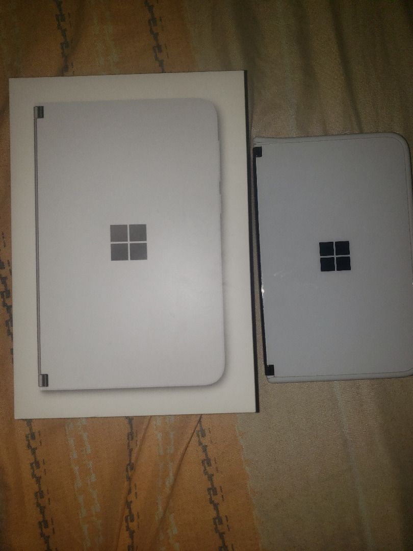 Microsoft Surface Duo 128GB (Unlocked) - Glacier Android Operating System with screen defect (Category: Android) located in Antipolo. Submitted by shoppingmillennials (Listing ID 1262318957, Image 1). Description: Microsoft Surface Duo 128GB (Unlocked) - Glacier VERY SLIGHTLY USED but with Display/Screen defect issue Condition of the item: All features are fully functioning but the screen is defective. Unless the screen can be repaired or fixed, 