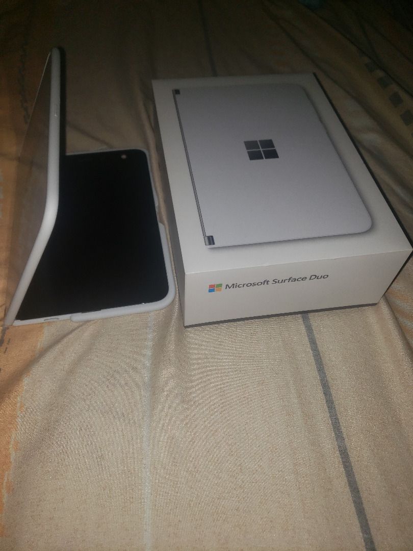 Microsoft Surface Duo 128GB (Unlocked) - Glacier Android Operating System with screen defect (Category: Android) located in Antipolo. Submitted by shoppingmillennials (Listing ID 1262318957, Image 3). Description: Microsoft Surface Duo 128GB (Unlocked) - Glacier VERY SLIGHTLY USED but with Display/Screen defect issue Condition of the item: All features are fully functioning but the screen is defective. Unless the screen can be repaired or fixed, 