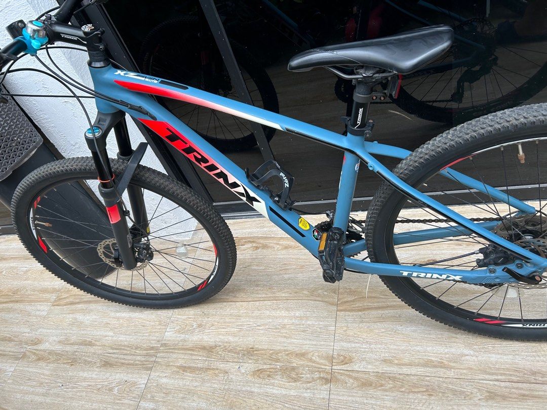 TRINX x7 Elite Mtb 27.5er (Category: Bicycles) located in Makati City. Submitted by nicolo. (Listing ID 1262146763, Image 1). Description: FRAME: FRAME: 27.5”x 19” or 21” Alloy Tri-Butted Smooth Welding with Internal Cable Routing FORK: Magnesium Air Remote LockOut Suspension ,Travel: 100MM NET WEIGHT: 12.1kg COMPONENTS: PEDAL: Feimin Alloy SADDLE: SR Sport HANDLEBAR: Trinx Alloy Flat DRIVETRAIN: SHIFTER: Shimano Deore SL-M6000 FD: Shimano Deore 
