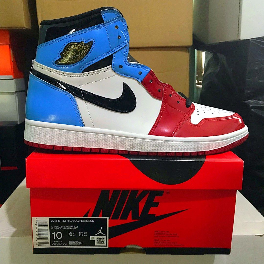 Jordan 1 retro high og fearless deals white/black/university blue men's shoe