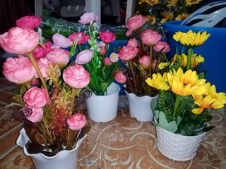 artificial flowers with plastic vase