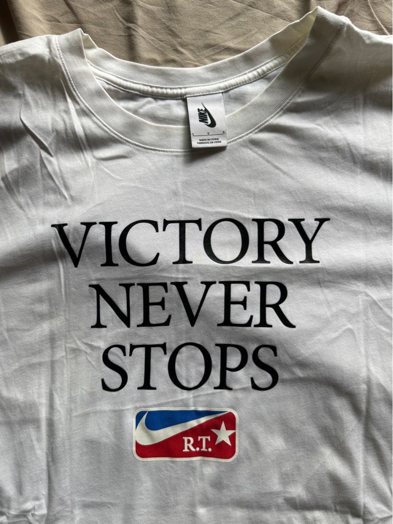 NIKE X RICARDO TISCI White Tee Victory Never Stops Peint Men s Fashion Tops Sets Tshirts Polo Shirts on Carousell