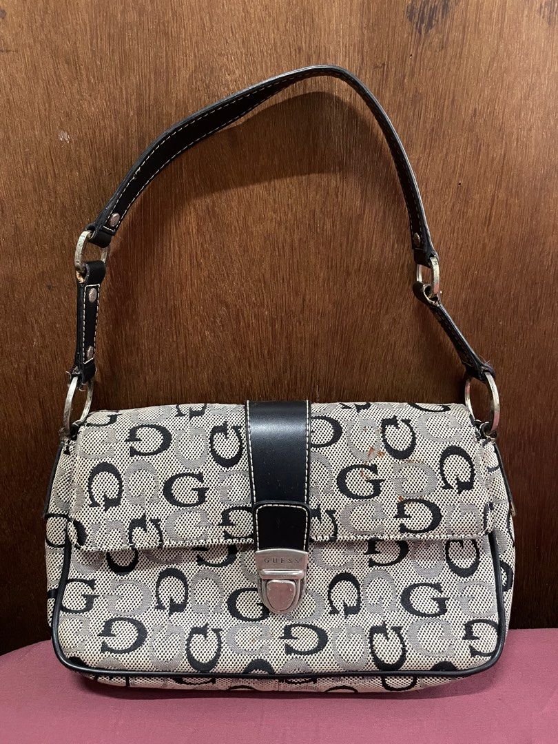 Guess Bag (Category: Shoulder Bags) located in Quezon City. Submitted by elleshops (Listing ID 1262544318, Image 1). Description: Original, money back guarantee if proven fake This is well used so there are flaws.