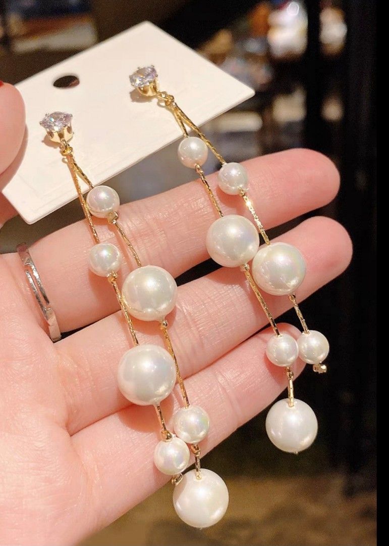 Long dangling pearls earrings