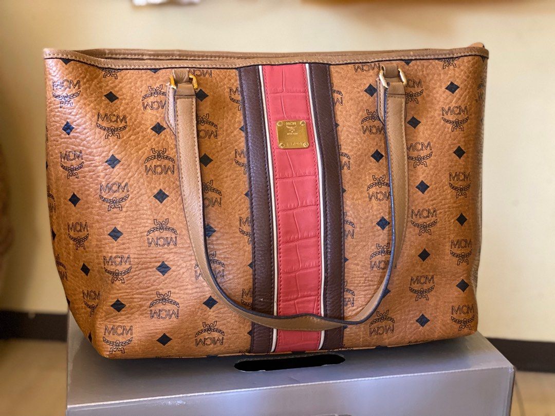 MCM Cognac (authentic) (Category: Luxury Bags & Wallets) located in Manila. Submitted by fayepalana (Listing ID 1262562413, Image 1). Description: RFS: Decluttering Preloved authentic McM bag Slightly used See attached photos for actual condition of the bag MOP: Gcash, Paymaya, BPI, BDO .