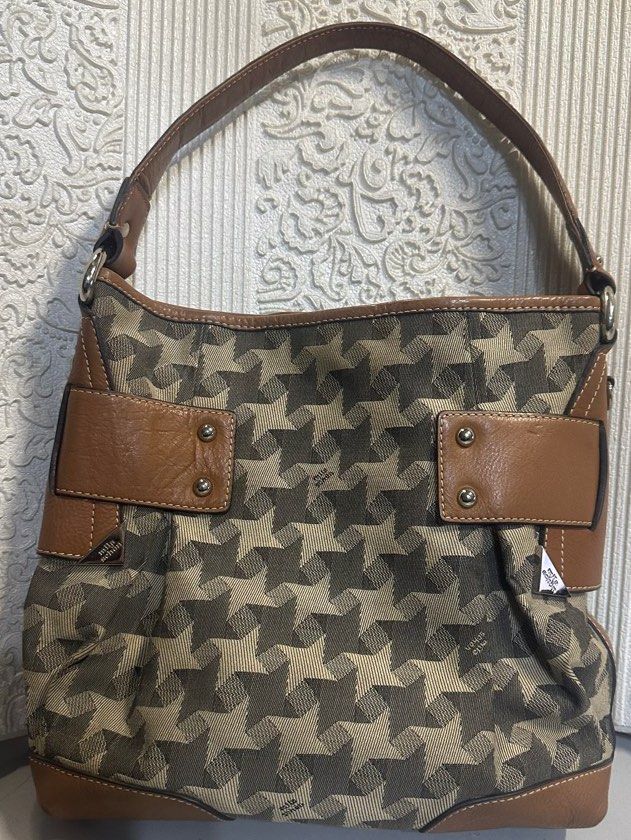 Mila Schon Bucket shoulder bag (Category: Luxury Bags & Wallets) located in Manila. Submitted by shopaholic_gurl (Listing ID 1262499472, Image 1). Description: Like new item Canvas printed bag Internal pockets Bucket style Silver hardware Sold as is.