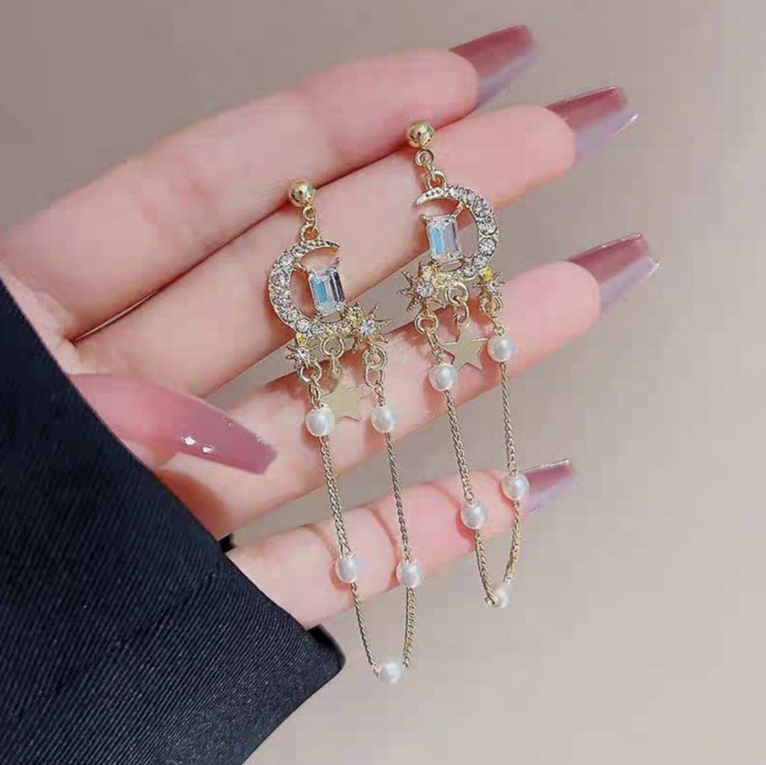 Mismatched rhinestone moon and star with long tassel dangle