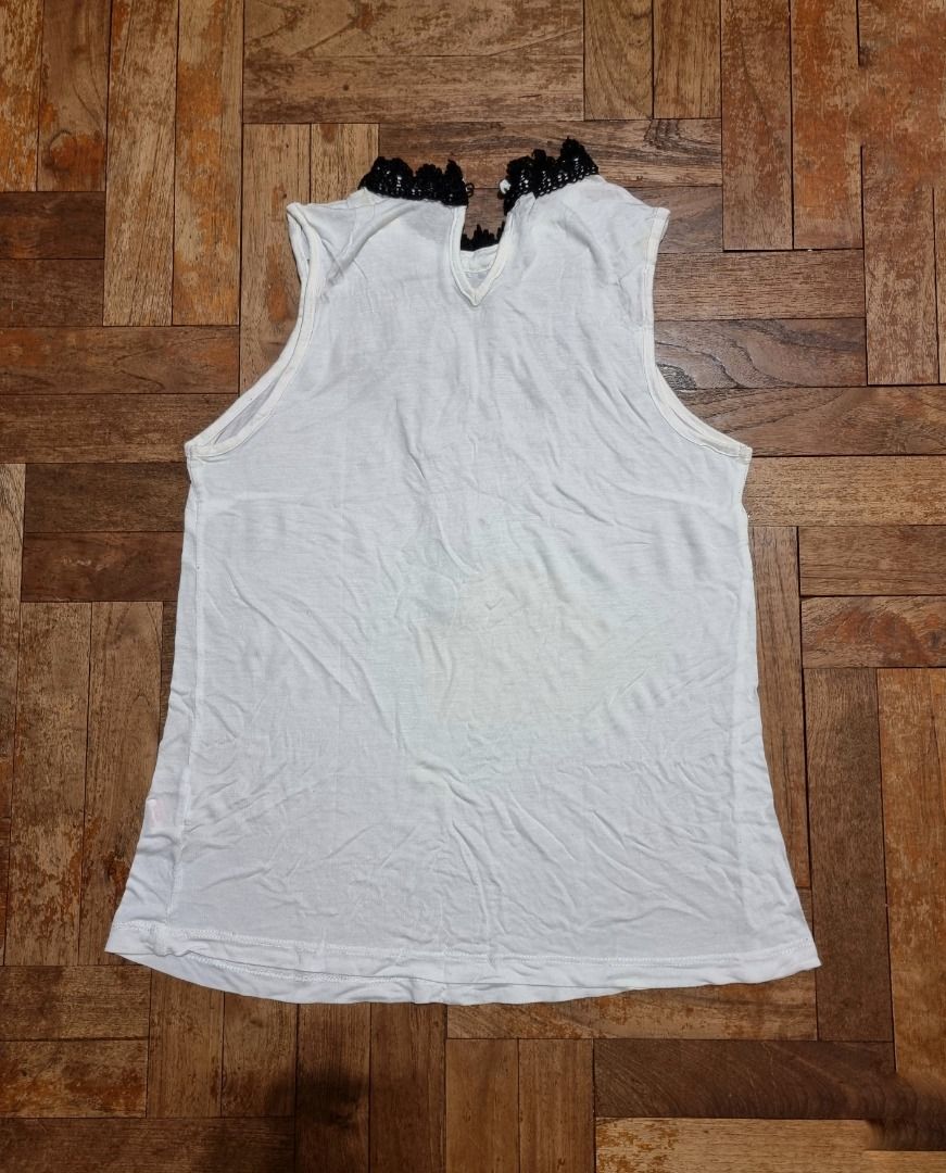 White top with online black lace overlay