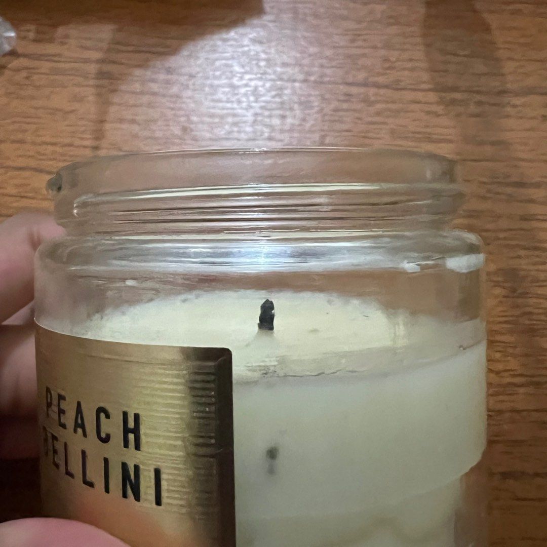 Bath & Body Works Single Wick Candle Peach Bellini (Category: Home Fragrance) located in Manila. Submitted by goingoncegoingtwice (Listing ID 1262757619, Image 3). Description: Scent Name: Peach Bellini Degree of usage as indicated in pictures. Bought for: 49aed or 800 pesos.