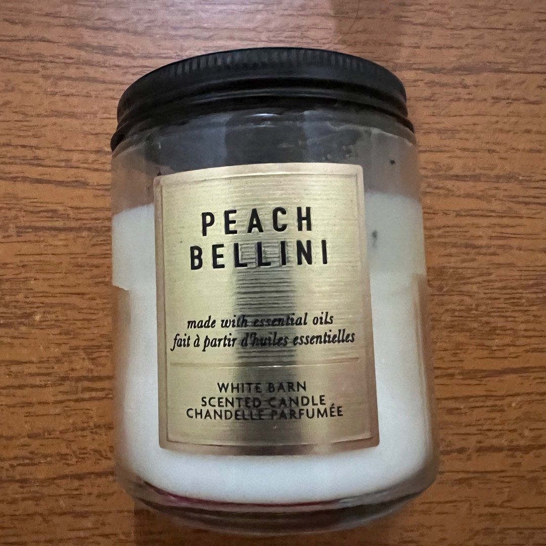 Bath & Body Works Single Wick Candle Peach Bellini (Category: Home Fragrance) located in Manila. Submitted by goingoncegoingtwice (Listing ID 1262757619, Image 1). Description: Scent Name: Peach Bellini Degree of usage as indicated in pictures. Bought for: 49aed or 800 pesos.