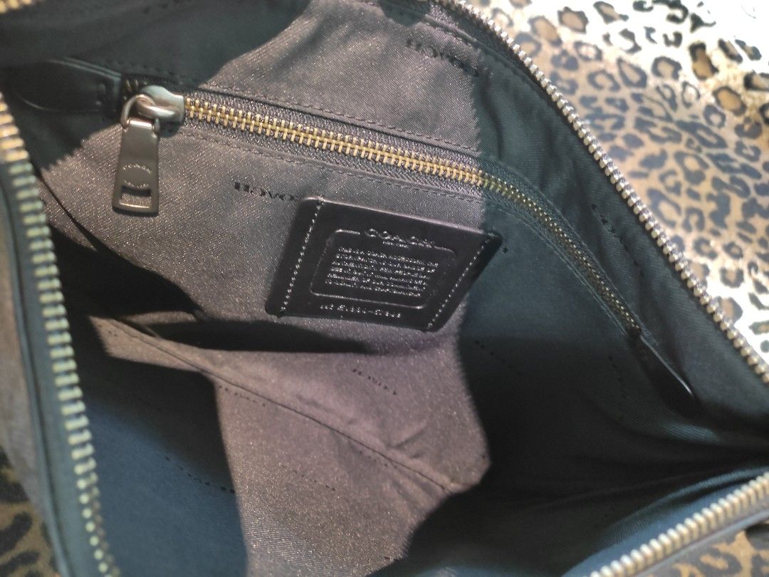 Coach dinosaur clutch store