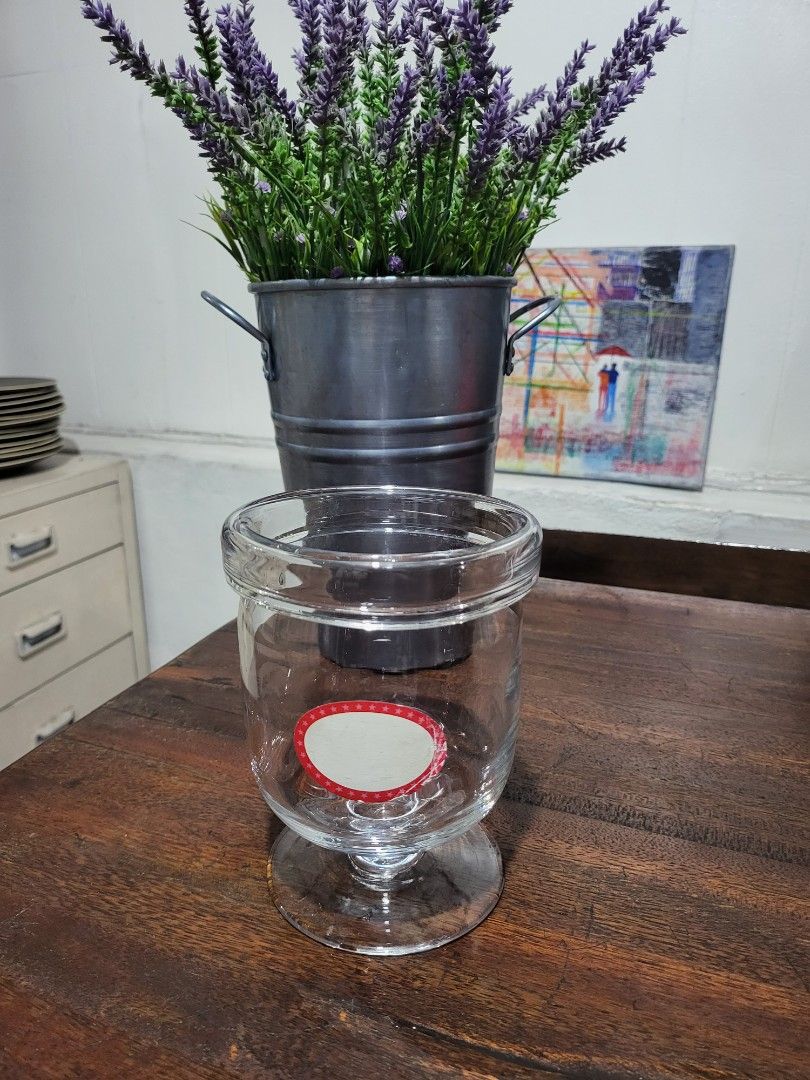 Glass Candy jar (Category: Food Organization & Storage) located in Makati City. Submitted by thedeclutteringabuela (Listing ID 1262828220, Image 1). Description: glass candy jar. 4 in , height 6in.