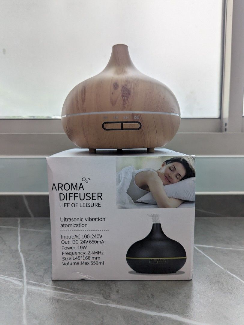 Aroma Diffuser (Category: Home Fragrance) located in Singapore. Submitted by doseofsunshine (Listing ID 1258178750, Image 1). Description: AROMA DIFFUSER Ultrasonic vibration atomization Input:AC 100-240V Out: DC 24V 650mA Power: 10W Frequency: 2.4MHz Size:145 168 mm Volume:Max 550ml.