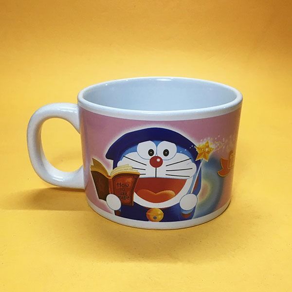 Doraemon Ceramic Cup (wide) (Category: Coffee & Tea Tableware) located in Mandaluyong City. Submitted by yula_noveltyfinds (Listing ID 1258112947, Image 2). Description: Perfect for a cottage core themed setting - Japan surplus - ceramic cup - good condition - size: approx: 4" (W) x 5.25" (L including handle) x 2.75" (H) These are surplus items please manage your expectations, thank you. Actual product color may vary from the images shown. Every 