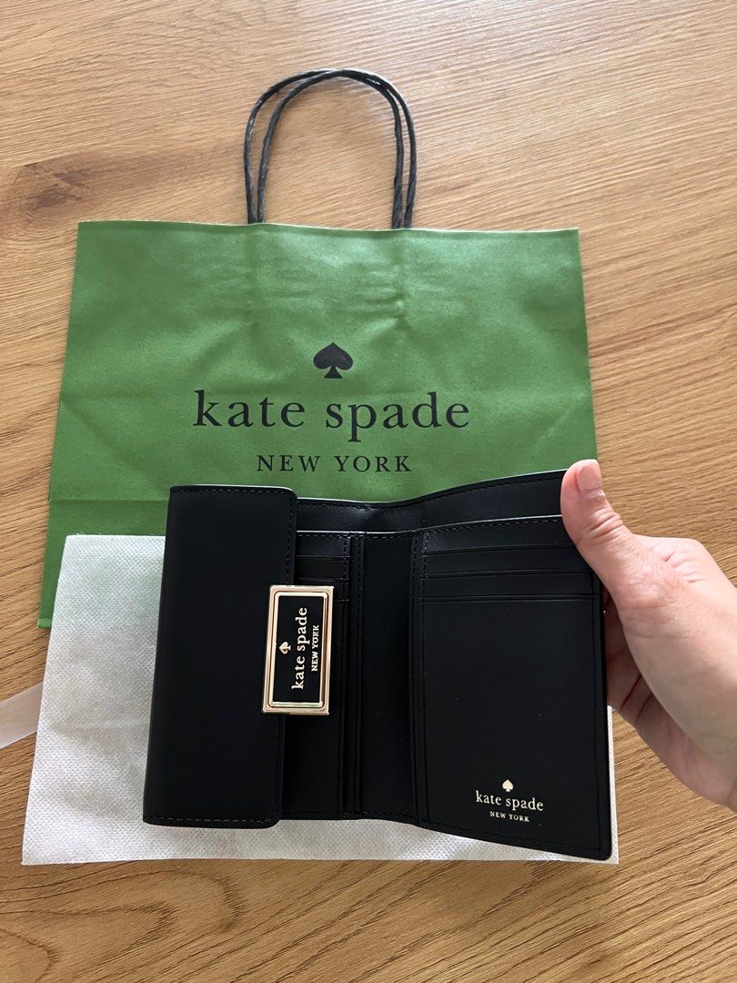 Kate Spade Regan Medium Flap Wallet (Category: Luxury Bags & Wallets) located in Makati City. Submitted by welllovedhandmedowns (Listing ID 1258062651, Image 2). Description: Kate Spade Regan Medium Flap Wallet in Black No box but comes with dust bag and Kate Spade paperbag as shown in photo Bought at Rinku Premium Outlets in Osaka Perfect gift this holiday season!.