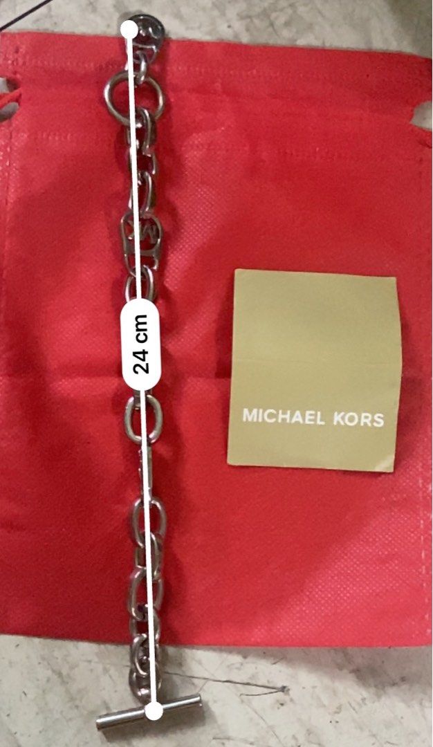 Michael Kors MK silver bracelet (Category: Luxury Accessories) located in Manila. Submitted by jaes_closet (Listing ID 1258119945, Image 2). Description: Good as new. Fashion bracelet not sterling silver. Measurement on the second picture .