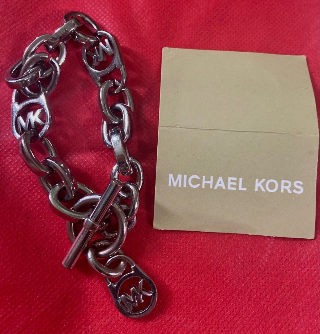 Michael Kors MK silver bracelet (Category: Luxury Accessories) located in Manila. Submitted by jaes_closet (Listing ID 1258119945, Image 1). Description: Good as new. Fashion bracelet not sterling silver. Measurement on the second picture .