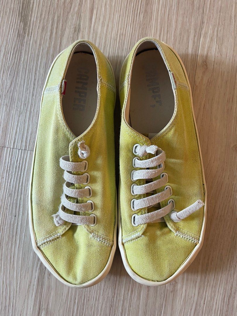 Camper slip on shoes made with canvas and elastics. Rubber sole