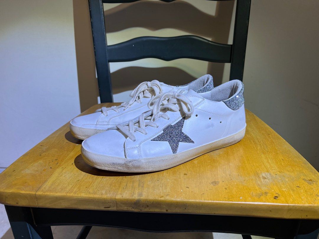 Golden Goose s Superstar sneakers adorned with silver glitter
