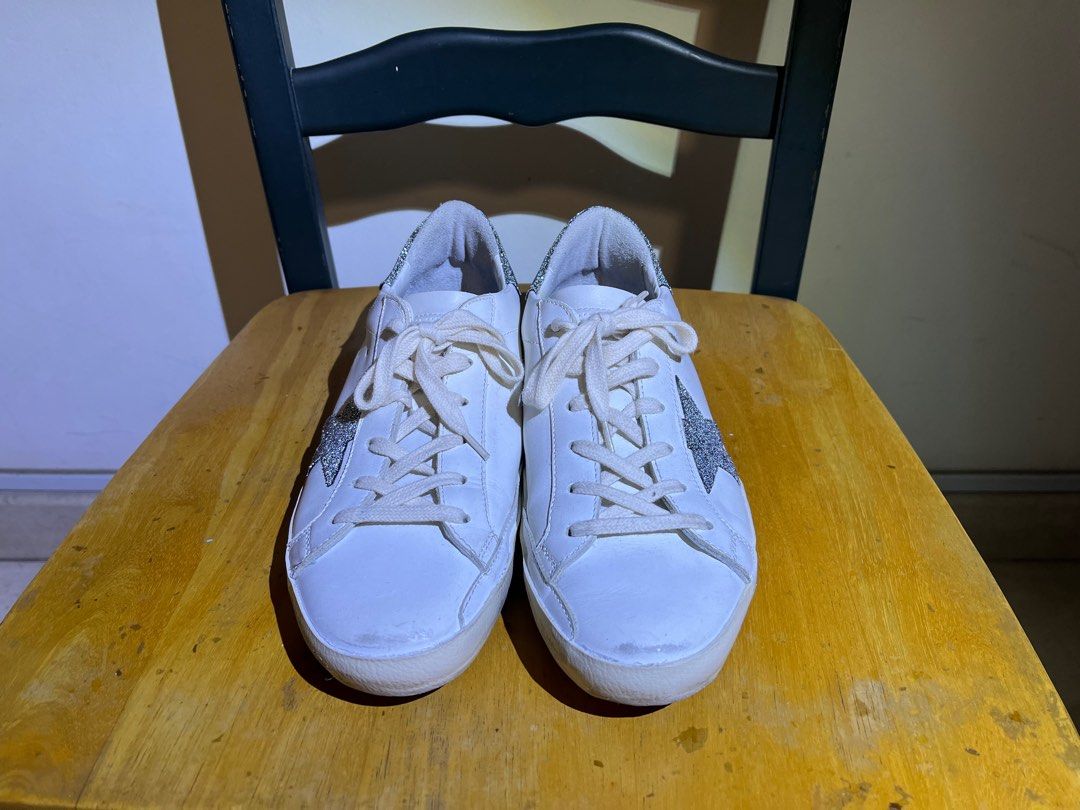Golden Goose s Superstar sneakers adorned with silver glitter