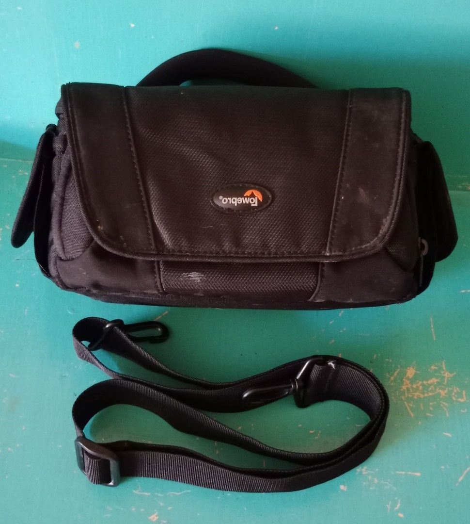 Lowepro camera bag (Category: Camera Bags & Carriers) located in Pasig City. Submitted by bluetolentino (Listing ID 1262861517, Image 1). Description: Lowepro black nylon - no runs, no holes, no rubs can fit 2 gadgets plus accessories with sling strap 9.5 in x 5 in x 4.5 in sign of use: pic #8 - I covered the name of the previous owner using a black permanent marker price negotiable.