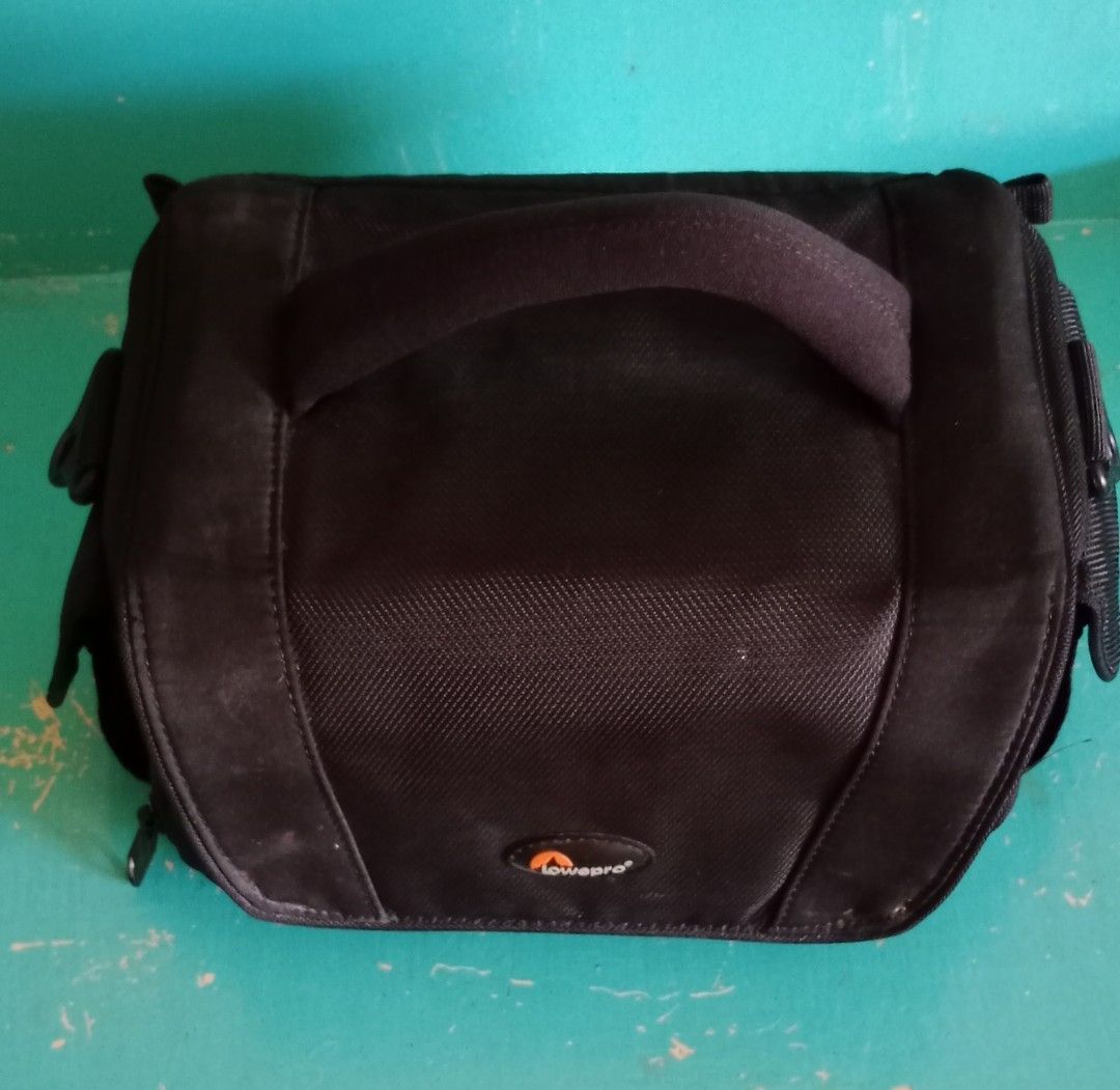 Lowepro camera bag (Category: Camera Bags & Carriers) located in Pasig City. Submitted by bluetolentino (Listing ID 1262861517, Image 2). Description: Lowepro black nylon - no runs, no holes, no rubs can fit 2 gadgets plus accessories with sling strap 9.5 in x 5 in x 4.5 in sign of use: pic #8 - I covered the name of the previous owner using a black permanent marker price negotiable.