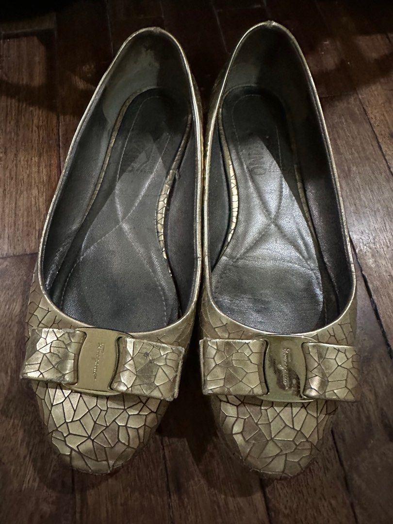 Salvatore Ferragamo Gold flats (Category: Flats & Sandals) located in Manila. Submitted by flutterbycloset (Listing ID 1262949083, Image 1). Description: Salvatore Ferragamo Size 6 gold flats SALE PRICE from 1,000.00 to 500.00.