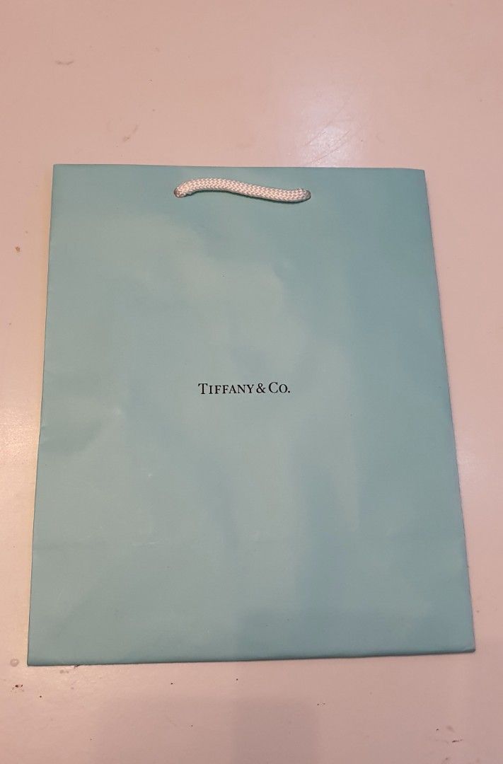 Authentic tiffany&co paperbag (Category: Luxury Bags & Wallets) located in Cavite. Submitted by ohmie23 (Listing ID 1263075939, Image 1). Description: Authentic tiffany&co paperbag dimention 8x10 inch.