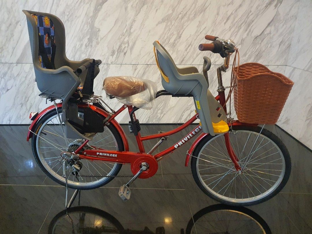 3 wheel bike with child seat in top front
