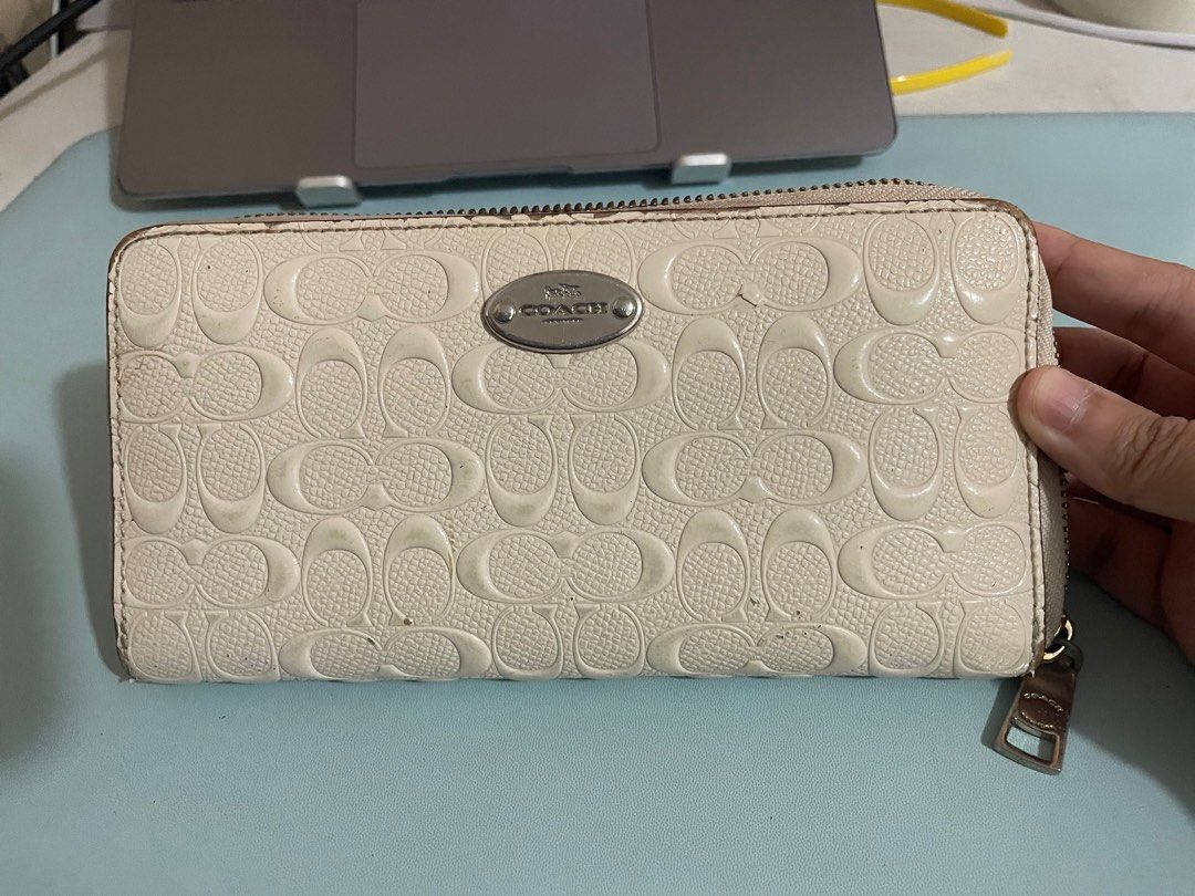 Coach Long wallet (Category: Luxury Bags & Wallets) located in Paranaque City. Submitted by declutterqueeen (Listing ID 1263034431, Image 1). Description: Original White coach long wallet With tags and care cards With obvious signs of usage (see photos) Rfs: decluttering.