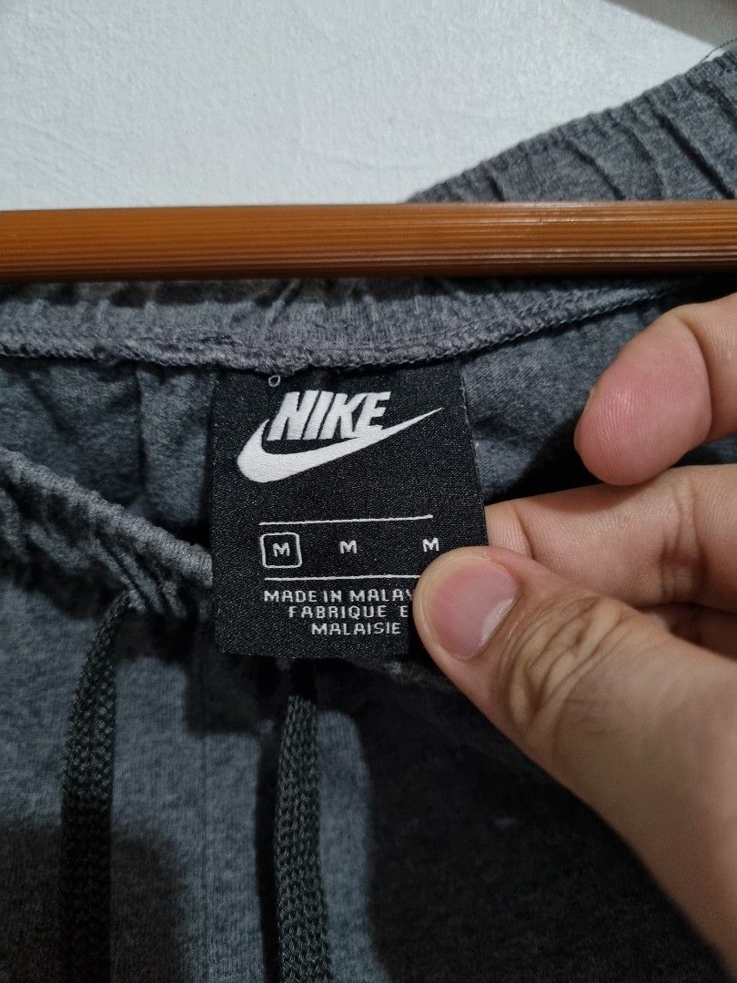 nike logo all over sweatpants