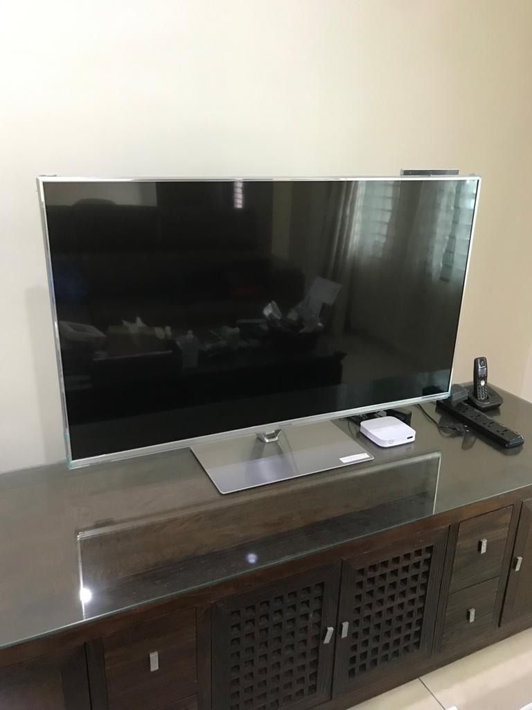 Panasonic LED 55inch TV with standalone camera accessory and TV stand