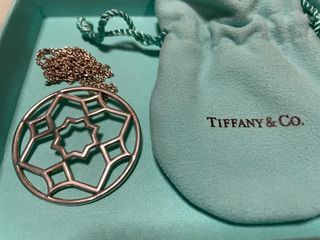 Sold at Auction: Tiffany & Co. - a shopping bag charm with Tiffany Blue  enamel finish, signed and marked 'AG 925 Germany', 2.1 cm drop, together  with travel pouch, exterior box and