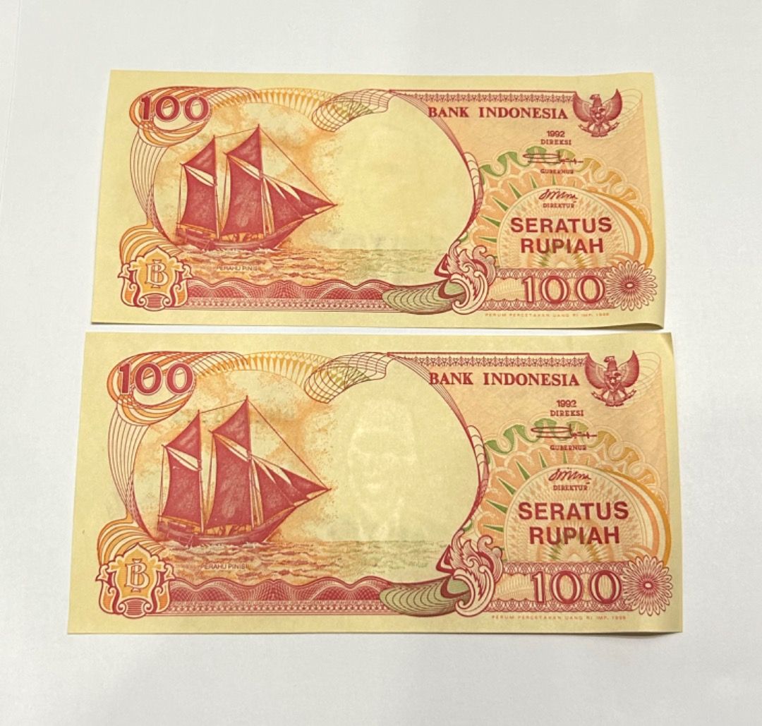 2 runs Indonesia Rupiah 100 bank notes ( Seratus Volcano series ...