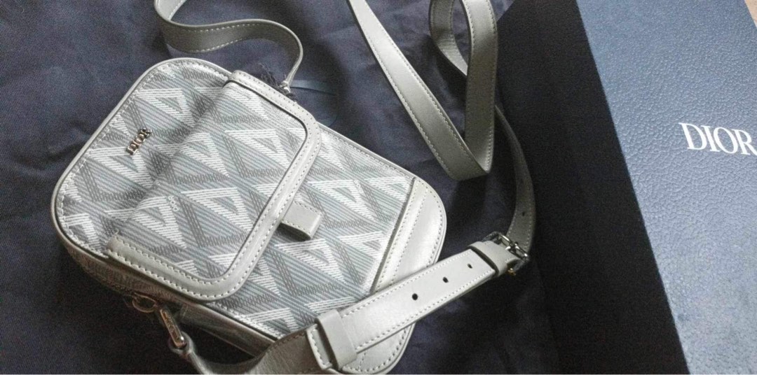 Dior vertical pouch, Luxury, Bags & Wallets on Carousell