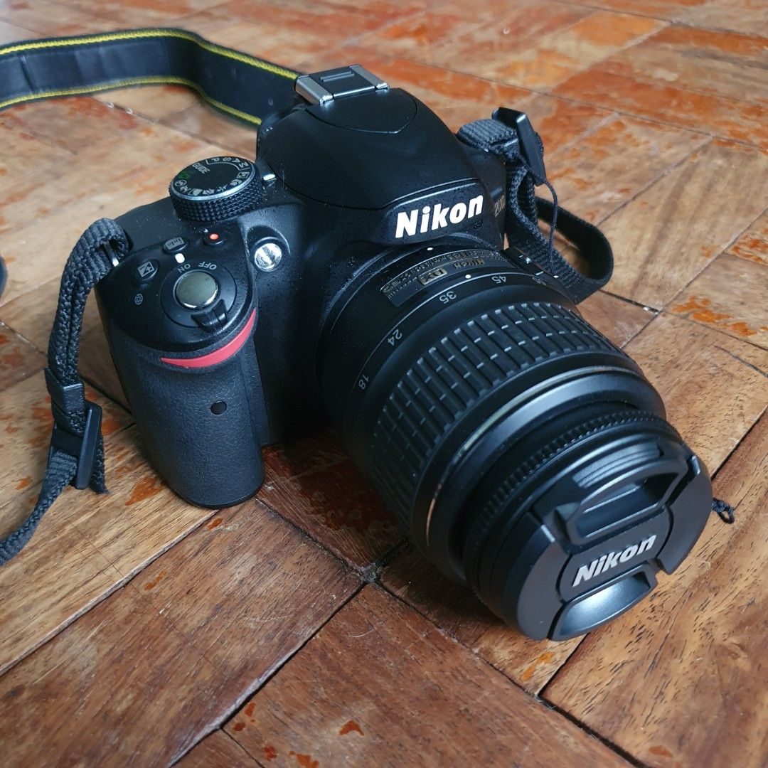 Nikon D3200 (with extra lens, bag, and tripod) (Category: Cameras) located in Pasig City. Submitted by juliansantos13 (Listing ID 1258273134, Image 2). Description: FS: Nikon D3200 set -VG condition -low shutter count -includes 18-55 and 55-200 lenses (no scratches/fungus, AF working) and a lens pouch -LCD is bright (no vignetting) -includes Nikon camera bag -includes tripod (63” extended, 24” collapsed) -honest issue: ports cover is missing (see