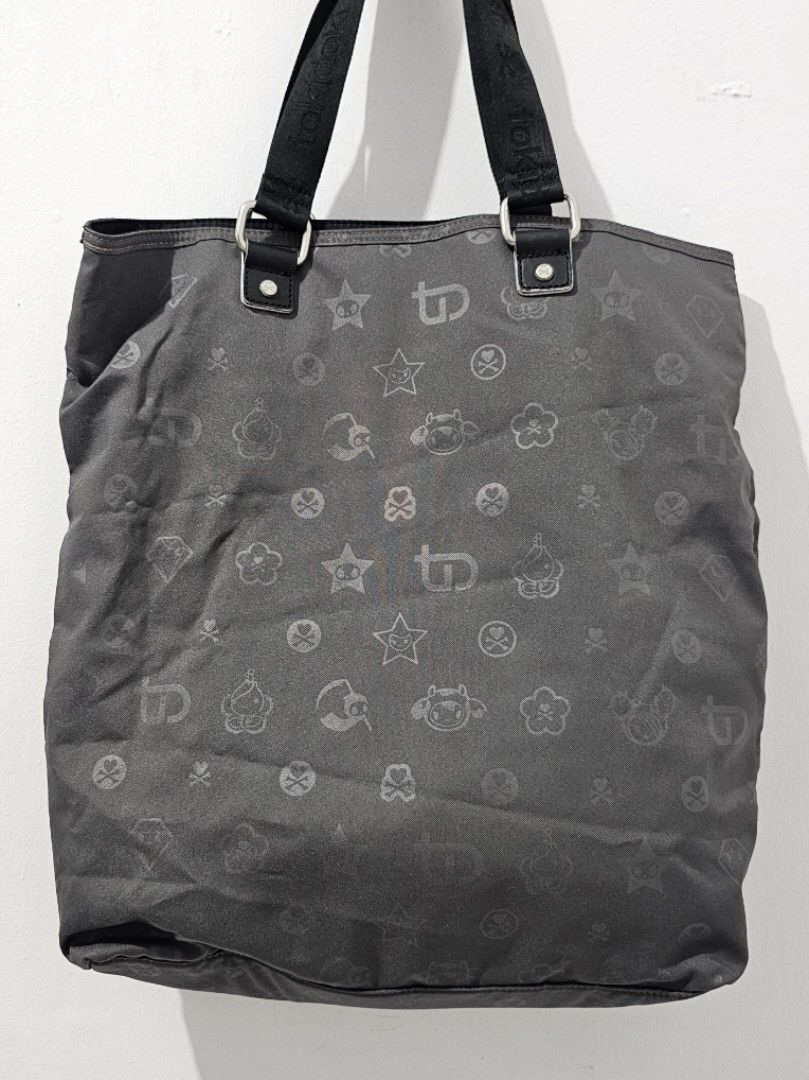Authentic Tokidoki Dark Grey Tote Bag (Big) (Category: Tote Bags) located in Manila. Submitted by keishache04272 (Listing ID 1258547488, Image 2). Description: Brand New with tag Bought in USA Lightweight, spacious, and chic Perfect for everyday use Meetup: Mister Kabab West Ave, Trinoma and SM North Edsa Delivery: Pay item first through BPI, BDO, or Gcash. Buyer book and pay for shipping with Lalamove or Grab.