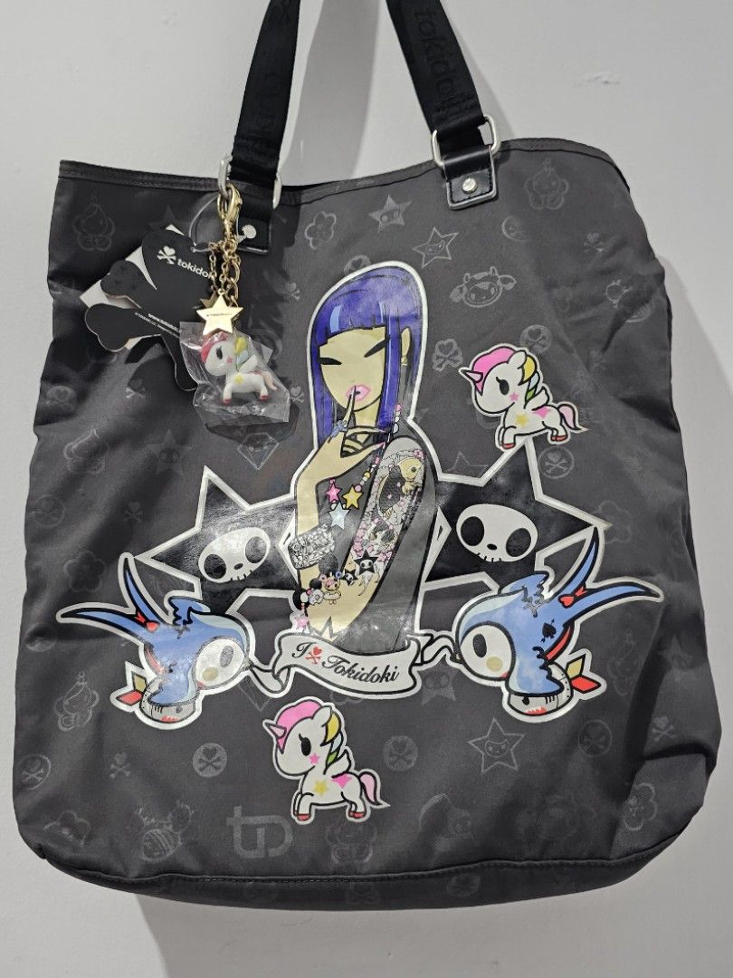 Authentic Tokidoki Dark Grey Tote Bag (Big) (Category: Tote Bags) located in Manila. Submitted by keishache04272 (Listing ID 1258547488, Image 1). Description: Brand New with tag Bought in USA Lightweight, spacious, and chic Perfect for everyday use Meetup: Mister Kabab West Ave, Trinoma and SM North Edsa Delivery: Pay item first through BPI, BDO, or Gcash. Buyer book and pay for shipping with Lalamove or Grab.