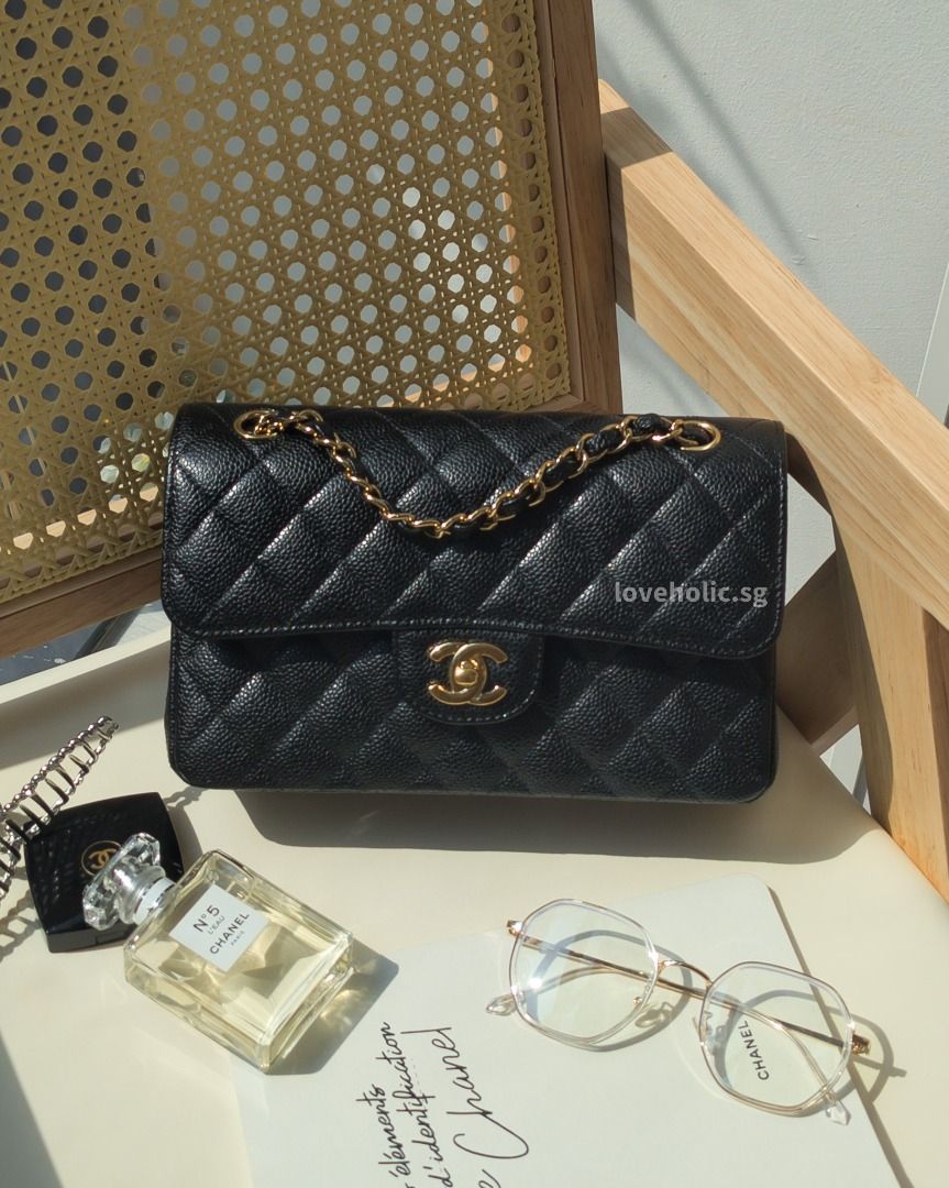 Gold and top black chanel bag