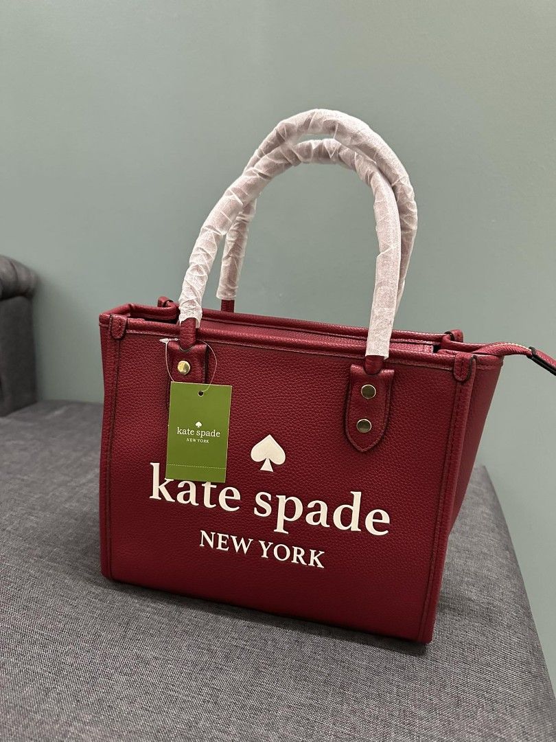 Kate Spade Cherry Red Sling Body Bag (Category: Luxury Bags & Wallets) located in Las Pinas. Submitted by ajbash (Listing ID 1258401945, Image 1). Description: with dust bag ang care card width: 13 inches length: 9 inches thickness: 3.5 inches.